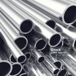 Heap of shiny metal steel pipes with selective focus effect, 3d illustration